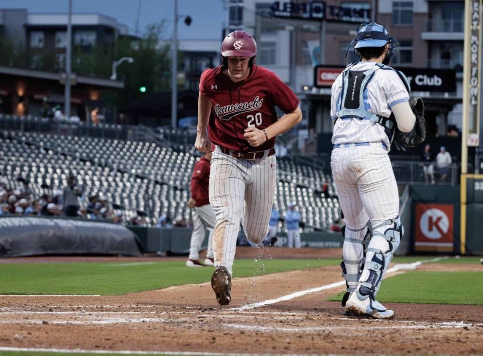 Gamecock outfield Ethan Petry (20) scores the games first run. North Carolina and South Carolina would play at Truist Field on April 9, 2024.