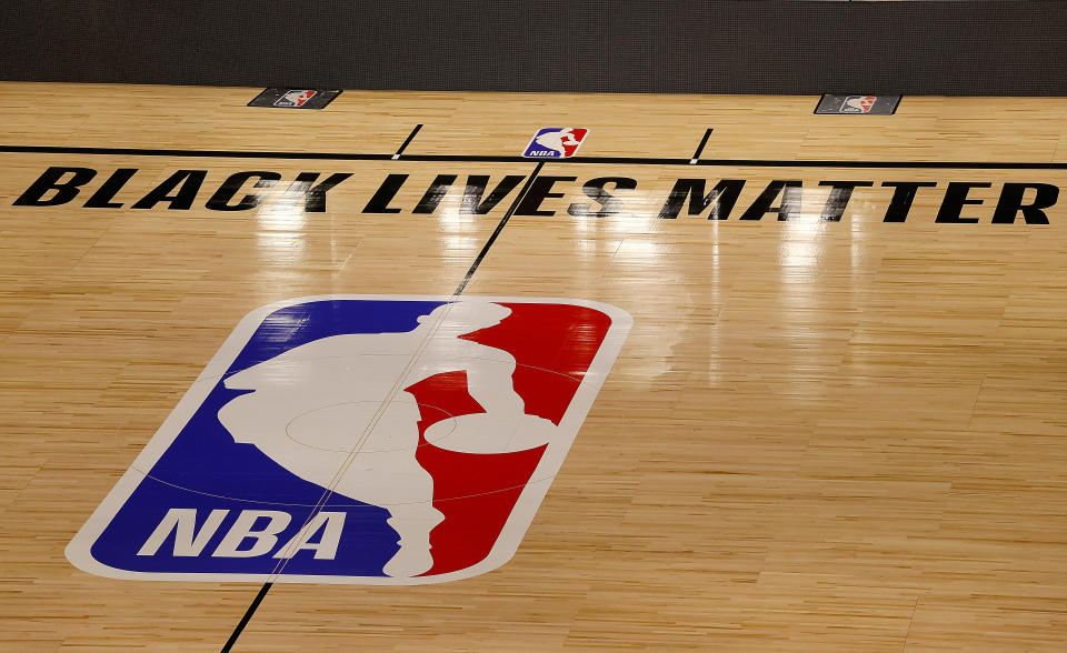 The Black Lives Matter logo is seen on an empty court as all NBA playoff games were postponed today during the 2020 NBA Playoffs at AdventHealth Arena.