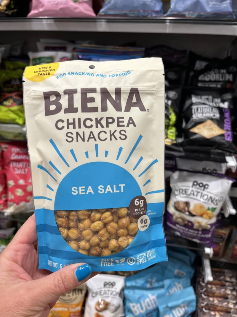 hand holding up a bag of Biena Chickpea Snacks - sea salt flavor