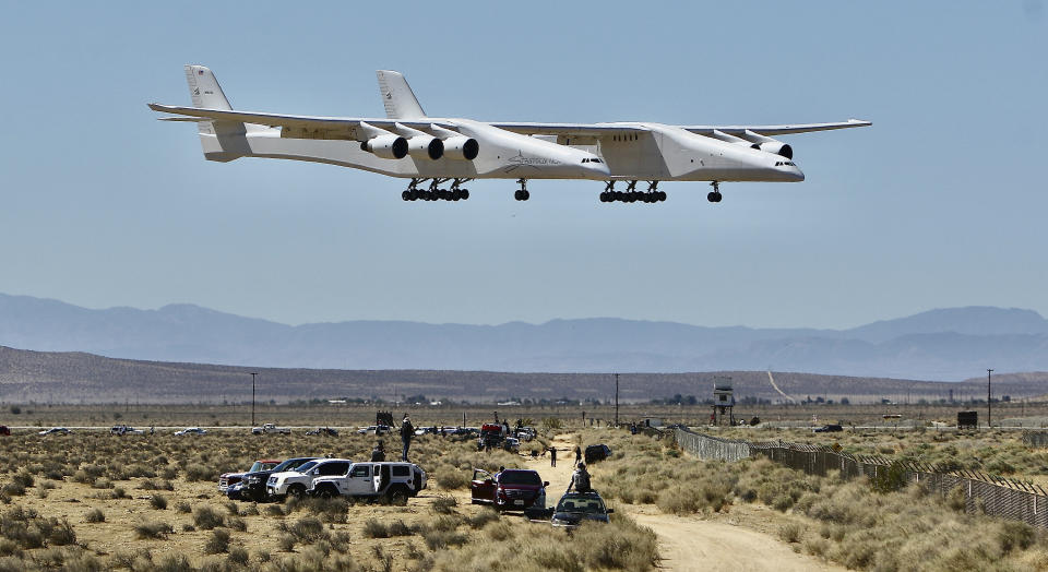 The Stratolaunch aircraft, a six-engine jet with the world's longest wingspan lands at Mojave Air and Space Port during craft's second flight, Thursday, April 29, 2021in Mojave, Calif. The gigantic aircraft has flew for the second time in two years. (AP Photo/Matt Hartman)