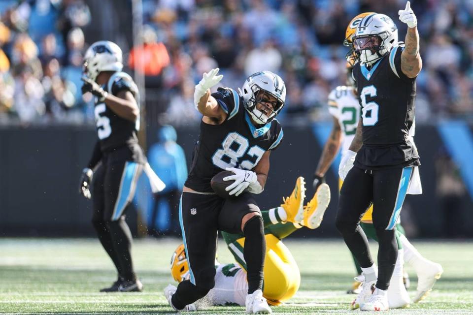 Carolina Panthers tight end Tommy Tremble (82) gestures for a first down after a run during the game against the Packers at Bank of America Stadium on Sunday, December 24, 2023.