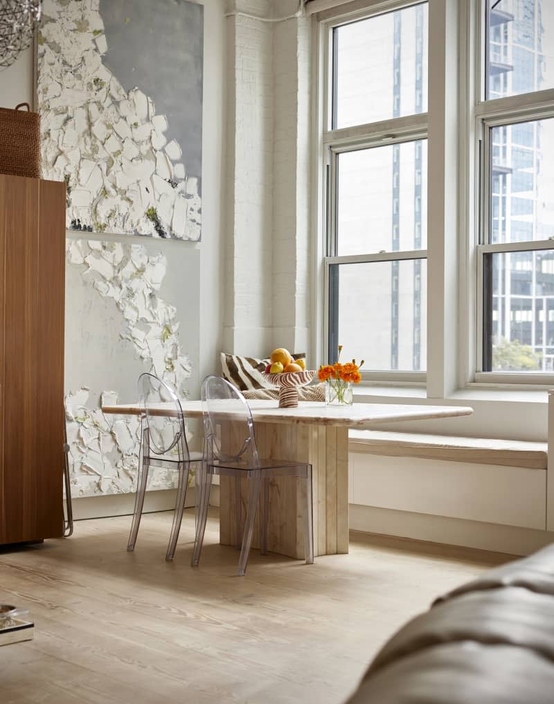 Marble dining room table in light filled city apartment.