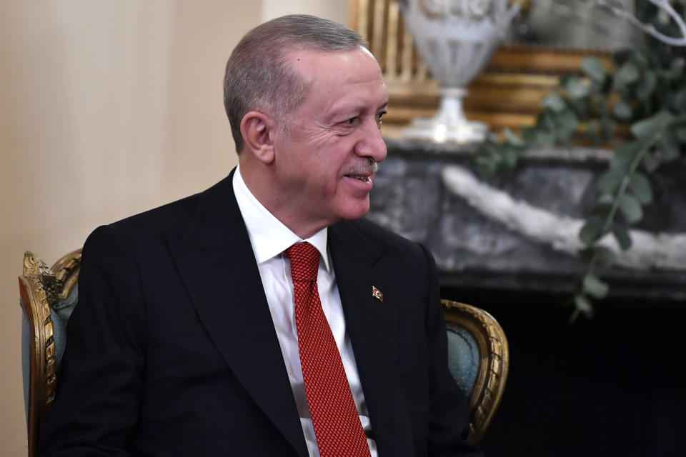 Turkish President Recep Tayyip Erdogan smiles during a meeting with Greece's President Katerina Sakellaropoulou at the Presidential Palace in Athens, Greece, Thursday, Dec. 7, 2023. Erdogan arrived in Greece on a visit designed to set the historically uneasy neighbors on a more constructive path and help repair strained his country's strained relationship with the European Union. (AP Photo/Michael Varaklas)