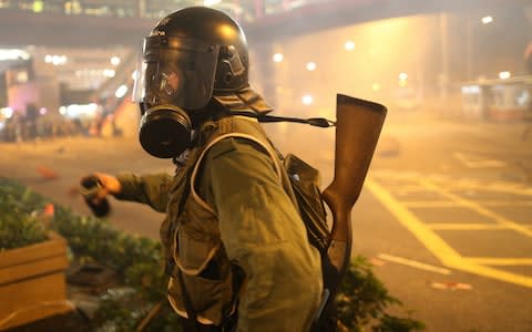 Hong Kong's protest movement escalated violently and was met with tear gas - Credit: REX