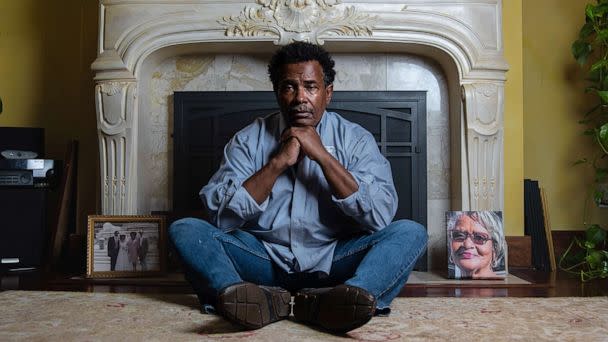 PHOTO: Garnell Whitfield Jr. in his home with a photo of his mother, 86-year-old Ruth Whitfield, to his left, Oct 12, 2022. (Malik Rainey/ABC News)