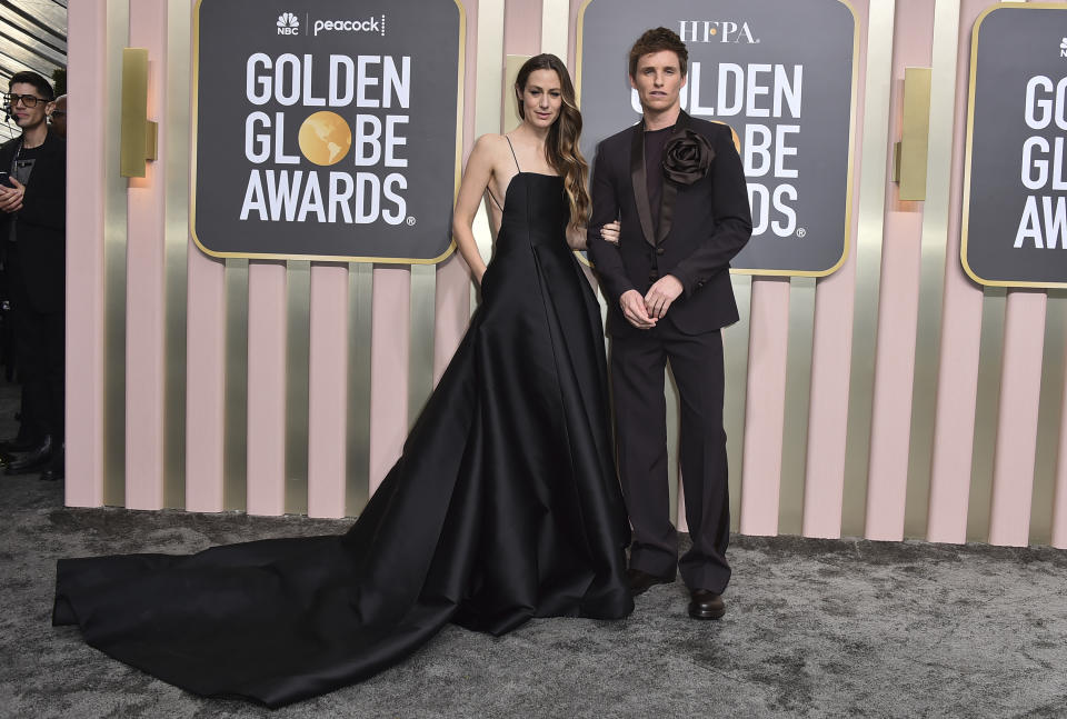 Eddie Redmayne, right, and Hannah Bagshawe arrive at the 80th annual Golden Globe Awards at the Beverly Hilton Hotel on Tuesday, Jan. 10, 2023, in Beverly Hills, Calif. (Photo by Jordan Strauss/Invision/AP)