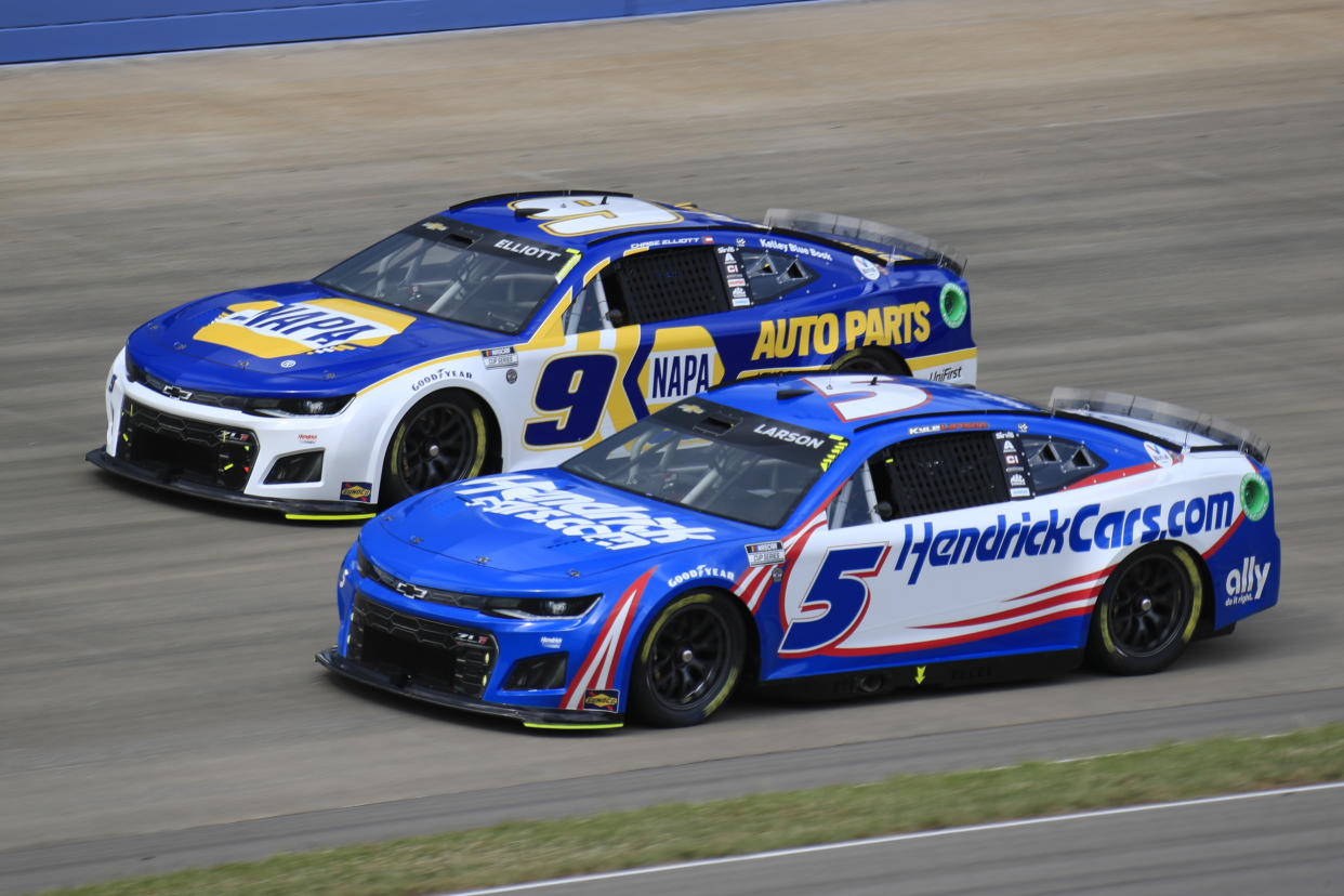 NASHVILLE, TN - JUNE 26: Kyle Larson (#5 Hendrick Motorsports HendrickCars.com Chevrolet) races with Chase Elliott (#9 Hendrick Motorsports NAPA Auto Parts Chevrolet) during the running of the 2nd annual NASCAR Cup Series Ally 400 on June 26, 2022 at Nashville SuperSpeedway in Nashville, TN. (Photo by Jeff Robinson/Icon Sportswire via Getty Images)