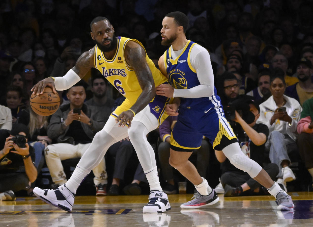 Los Angeles Lakers forward LeBron James controls the ball against Golden State Warriors guard Stephen Curry in the first half of Game 6 of a Western Conference semifinals series at the Crypto.com Arena in Los Angeles on May 12, 2023. (Keith Birmingham/MediaNews Group/Pasadena Star-News via Getty Images)