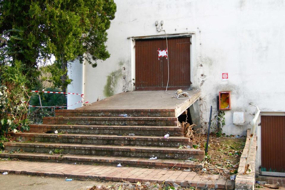 A view of the rear entrance of the disco 'Lanterna Azzurra' in Corinaldo, central Italy, Saturday, Dec. 8, 2018. Italian police say a stampede at a rap concert in an overcrowded disco killed five young teenagers early Saturday along with a woman who had brought her daughter to the event. Fifty-three others were injured at the disco in central Italy where Italian rapper Sfera Ebbasta was to perform. Authorities said organizers had apparently sold too many tickets. Police say 13 of the injured are in serious condition. (Pasquale Bove/ANSA via AP)