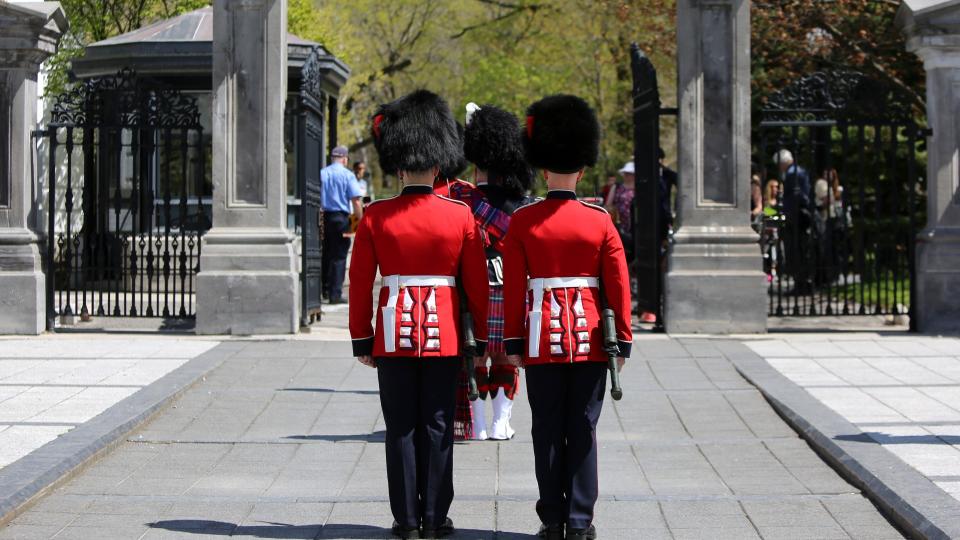 OTTAWA, ON, CANADA - MAY 6: Ceremonial Guards are seen as people visit Rideau Hall to celebrate the Coronation of His Majesty King Charles III in Ottawa, Ontario, Canada on May 6, 2023. Among the various activities offered, visitors are able to tour the residence, grounds, and greenhouses; view recordings of the Coronation service taking place in London and the Canadian celebration in Ottawa; listen to musical performances by members of the Central Band of the Canadian Armed Forces; and watch the Governor General's Foot Guards perform the Relief of the Sentries.