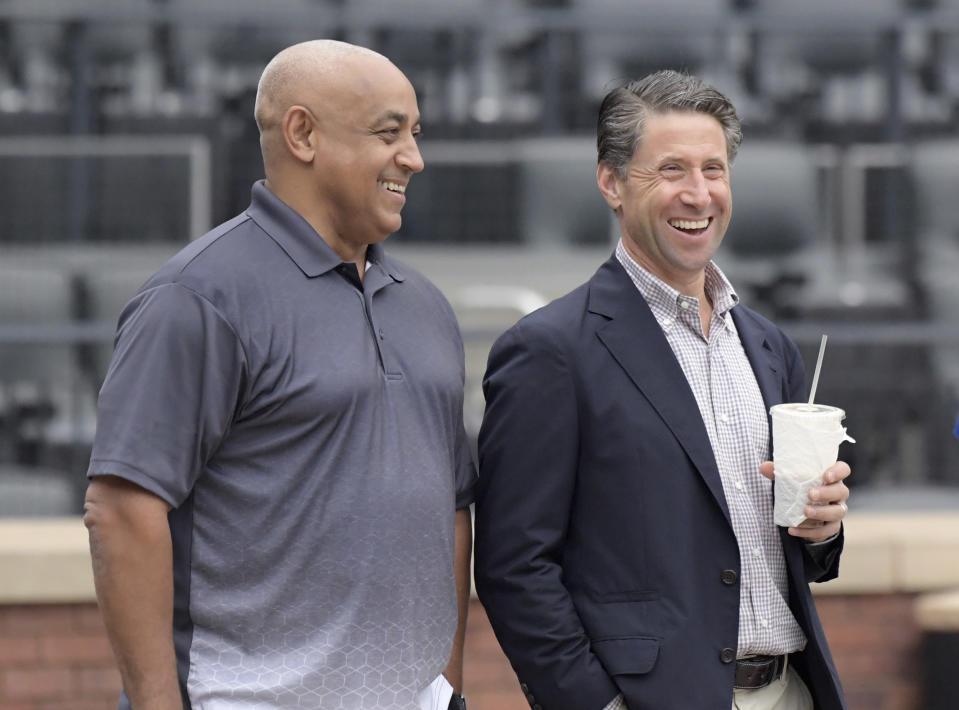 New York Mets owner Jeff Wilpon, right, and special assistant to the general manager Omar Minaya watch as David Wright plays in a simulated baseball game Saturday, Sept. 8, 2018, in New York. (AP Photo/Bill Kostroun)