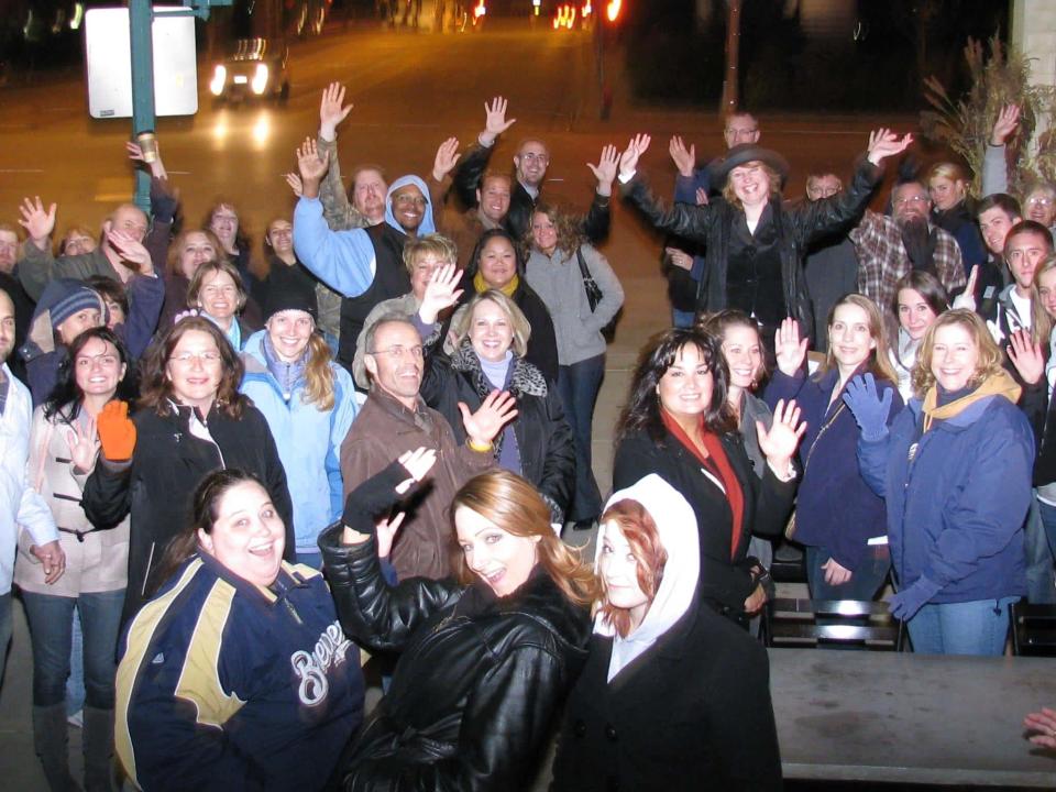 An American Ghost Walks tour group poses in Milwaukee's Third Ward on the "Bloody Third Ward" ghost walk. This was the first tour offered by the company, which began operating in 2008.