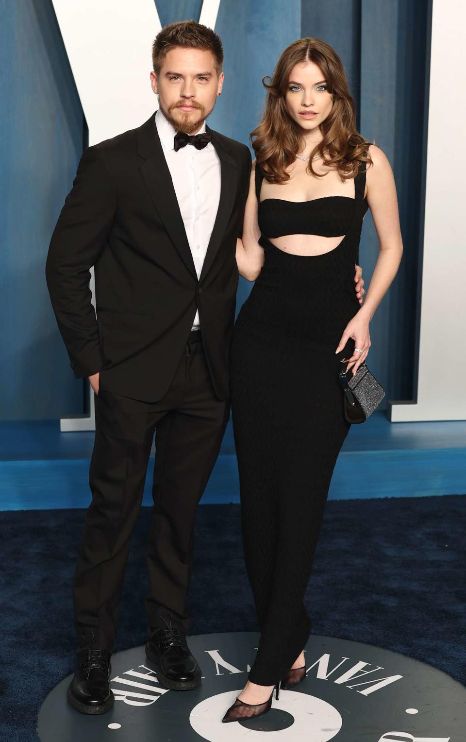 Dylan Sprouse and Barbara Palvin attend the 2022 Vanity Fair Oscar Party hosted by Radhika Jones at Wallis Annenberg Center for the Performing Arts on March 27, 2022 in Beverly Hills, California