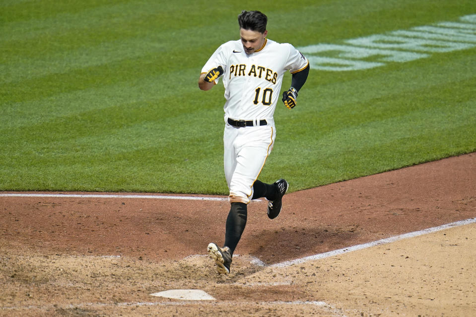 Pittsburgh Pirates' Bryan Reynolds crosses home plate after hitting a two-run inside-the-park home run off St. Louis Cardinals starting pitcher Matthew Liberatore during the fifth inning of a baseball game in Pittsburgh, Saturday, May 21, 2022. (AP Photo/Gene J. Puskar)