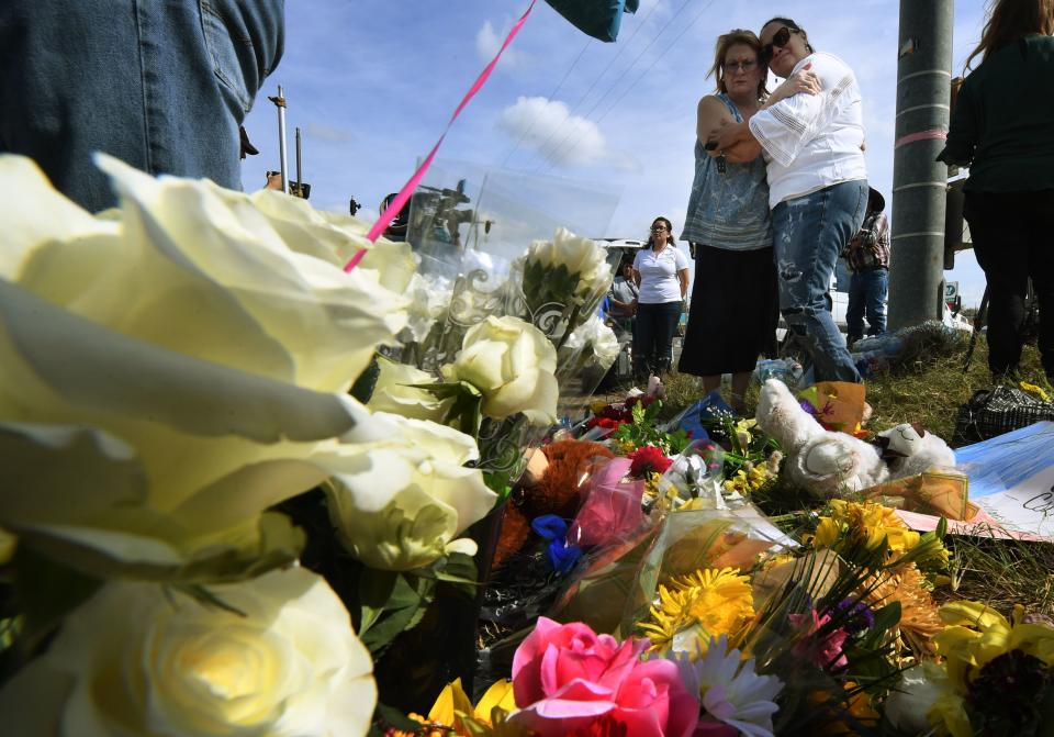 <p>Brenda Woldridge (L) and Meredith Cooper embrace at a memorial outside the First Baptist Church, after a mass shooting that killed 26 people in Sutherland Springs, Texas on Nov. 7, 2017. (Photo: Mark Ralston/AFP/Getty Images) </p>