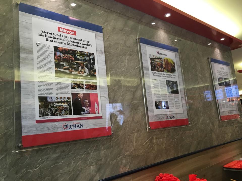 <p>Framed press clippings of Hong Kong Soya Sauce Chicken Rice & Noodle adorn the walls inside the air-conditioned restaurant. </p>