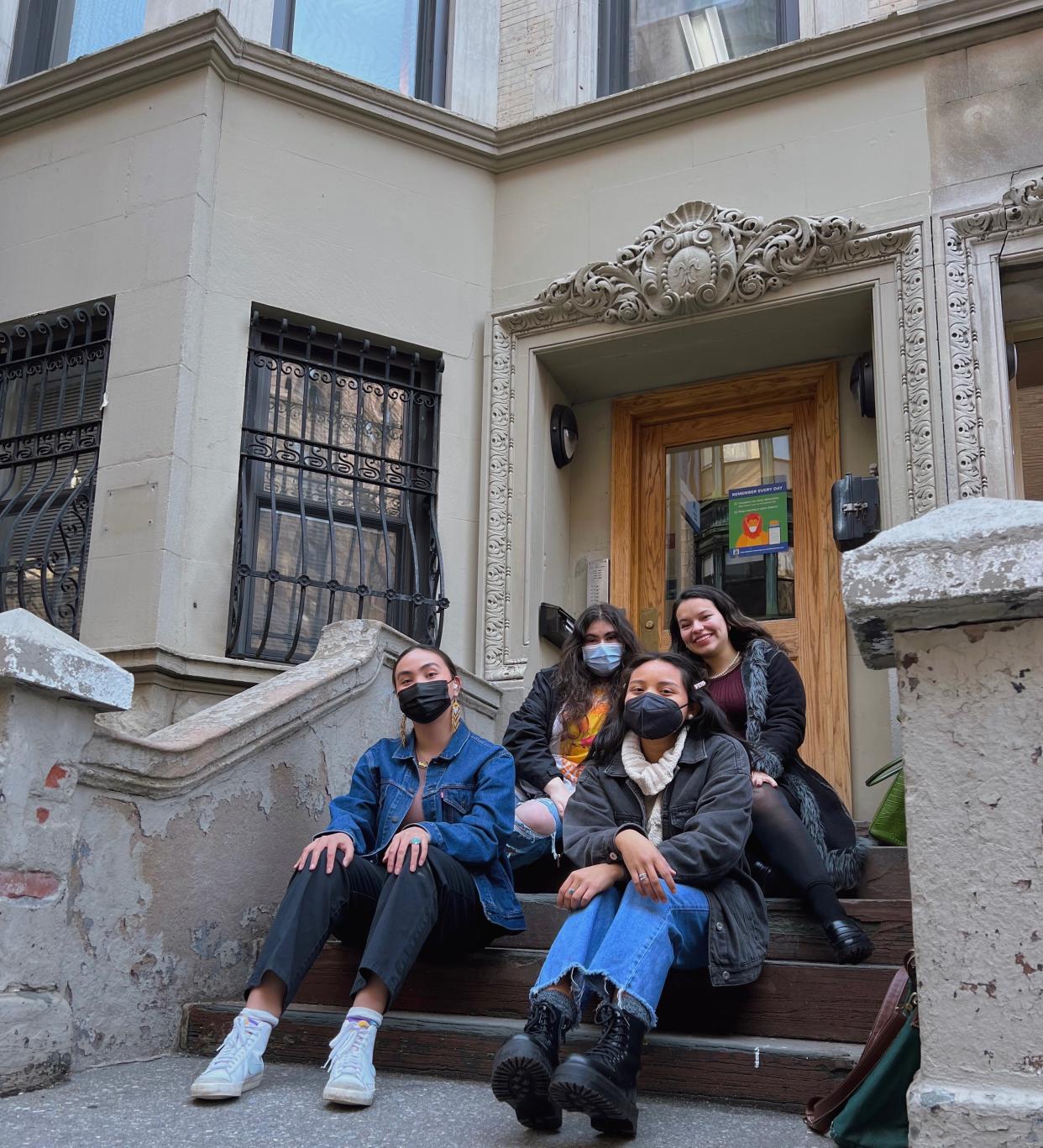 Columbia University students, Charitie Ropati, Hannah Jimenez, Kianna Pete and Eva Brander Blackhawk sit on the stoop of the brownstone that will become Indigehouse in New York City. (Photo/Courtesy Charitie Ropati)