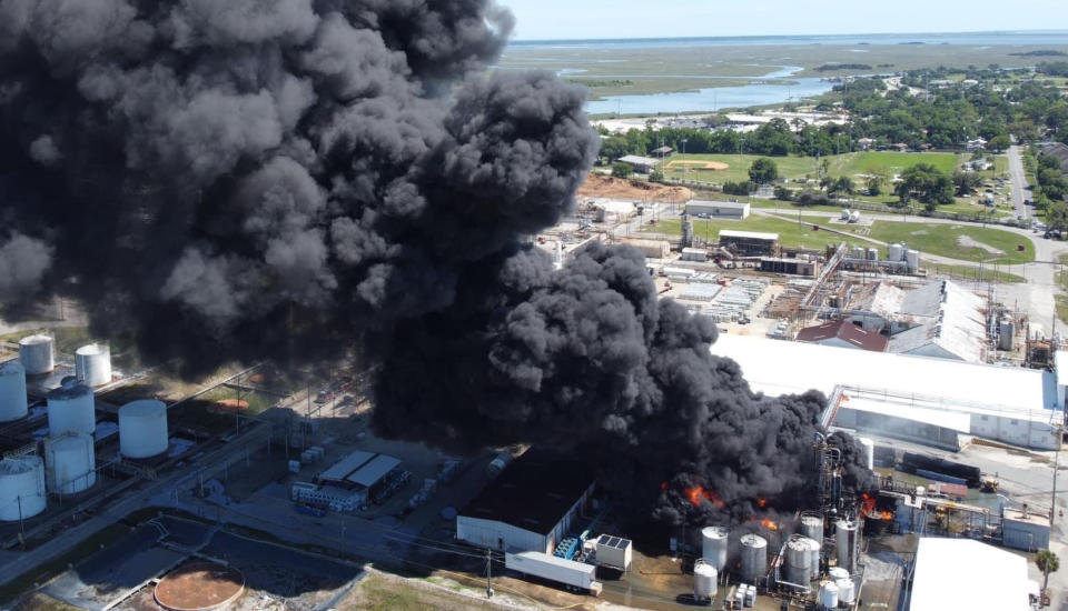 A fire at the Pinova plant in Brunswick, Georgia, on Saturday, sent a large plume of smoke into the air.  (Kyle Morgan via WSAV)