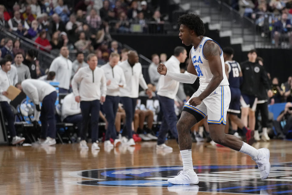 UCLA's David Singleton celebrates as the first half comes to an end of a Sweet 16 college basketball game against Gonzaga in the West Regional of the NCAA Tournament, Thursday, March 23, 2023, in Las Vegas. (AP Photo/John Locher)