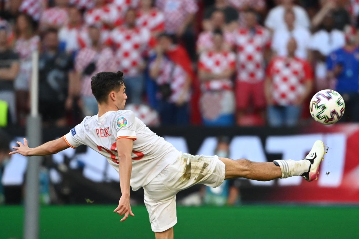 Spain's forward Pedri kikcs the ball during the UEFA EURO 2020 round of 16 football match between Croatia and Spain at the Parken Stadium in Copenhagen on June 28, 2021. (Photo by Jonathan NACKSTRAND / POOL / AFP) (Photo by JONATHAN NACKSTRAND/POOL/AFP via Getty Images)