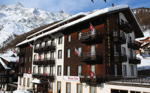 Exterior of the Sunstar hotel, with balconies flying Swiss flags