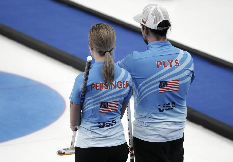 United States' Christopher Plys and United States' Victoria Persinger, compete during their mixed doubles curling match against Australia, at the 2022 Winter Olympics, Wednesday, Feb. 2, 2022, in Beijing. (AP Photo/Nariman El-Mofty)