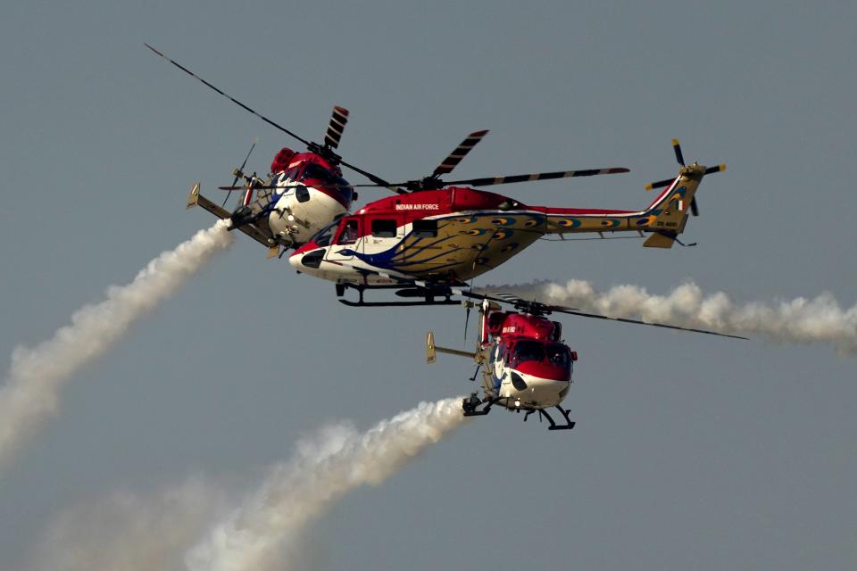 Sarang helicopter display team from India, perform during second day of the Dubai Air Show, United Arab Emirates, Tuesday, Nov. 14, 2023. (AP Photo/Kamran Jebreili)