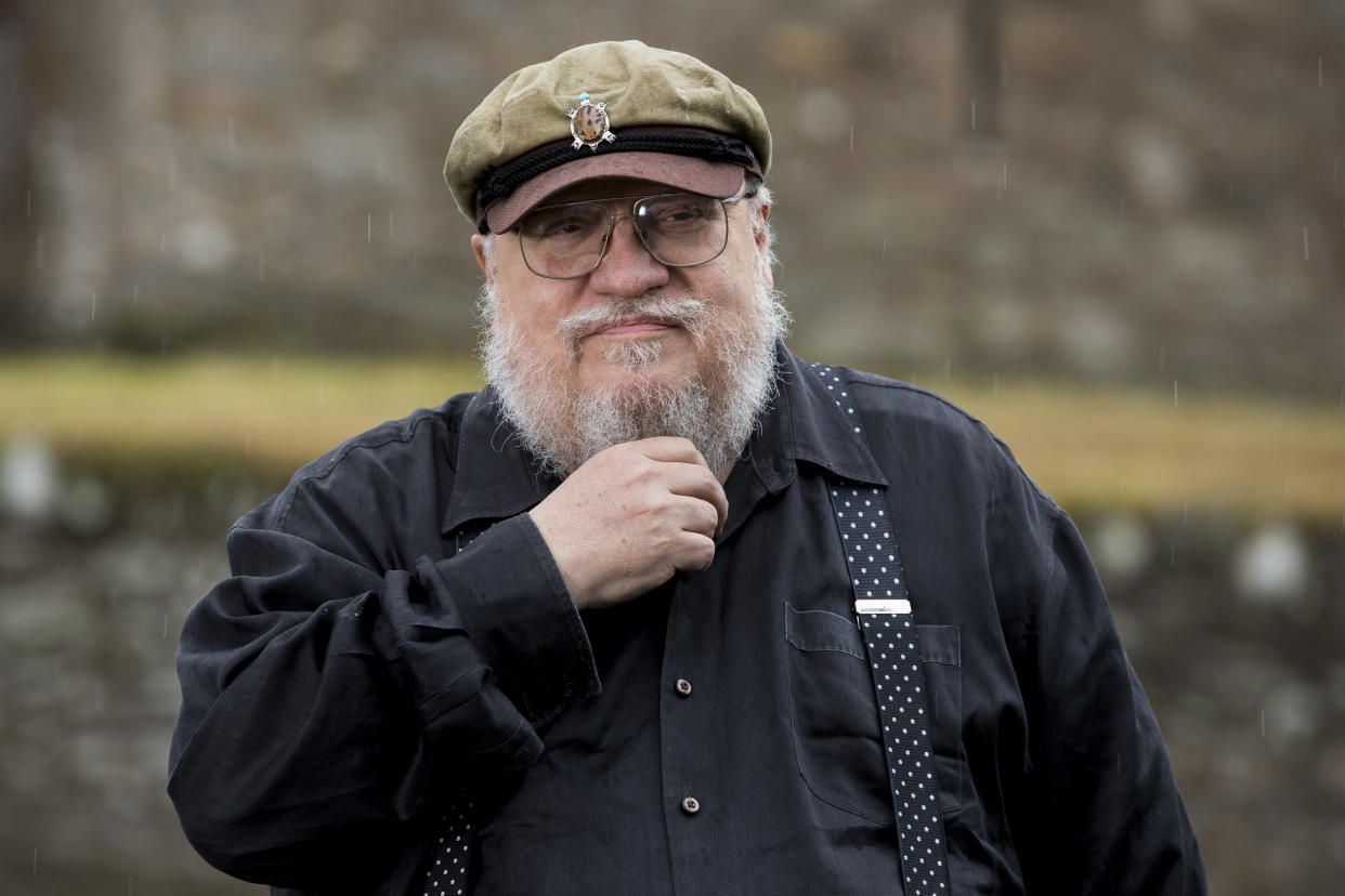 George R. R. Martin, American novelist and short story writer, best known for his series of epic fantasy novels, A Song of Ice and Fire, which was adapted into the HBO series Game of Thrones stands at fictional Winterfell Castle in the grounds of the National Trust property, Castle Ward, where scenes from the series were filmed, before an audience with George at Castle WardÕs theatre this evening. (Photo by Liam McBurney/PA Images via Getty Images)