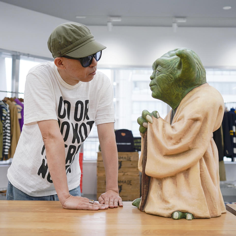 Designer Nigo of Kenzo with his life size Yoga creation offered in the sale