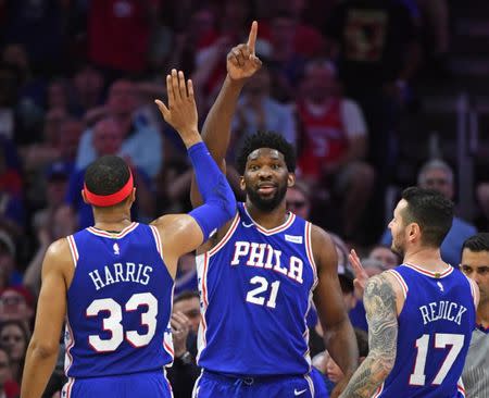 Apr 23, 2019; Philadelphia, PA, USA; Philadelphia 76ers center Joel Embiid (21) celebrates with forward Tobias Harris (33) and forward Jonathon Simmons (17) against the Brooklyn Nets during the third quarter in game five of the first round of the 2019 NBA Playoffs at Wells Fargo Center. Mandatory Credit: Eric Hartline-USA TODAY Sports