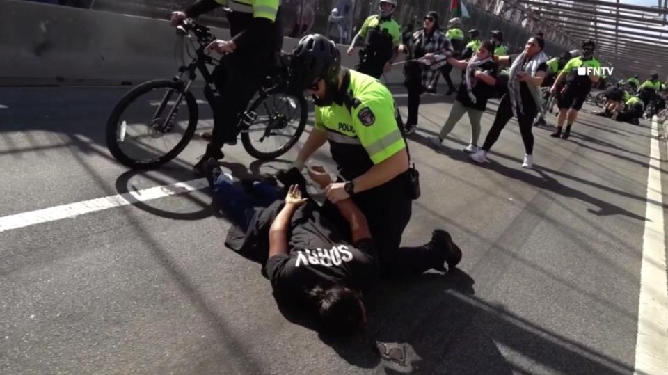 A police officer arresting a protestor. FNTV/Olga Fe