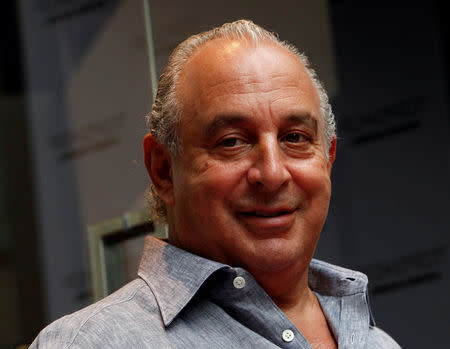 FILE PHOTO:British billionaire and CEO of the Arcadia Group Philip Green smiles as he attends the opening ceremony of a Topshop flagship store in Hong Kong June 6, 2013. REUTERS/Bobby Yip/File Photo