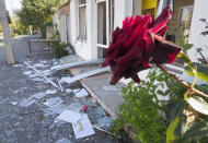 A shop damaged by Azerbaijan's artillery during military conflict in the town of Martuni, the separatist region of Nagorno-Karabakh, Friday, Oct. 23, 2020. Heavy fighting over Nagorno-Karabakh is continuing with Armenia and Azerbaijan trading blame for new attacks. Two Russia-brokered cease-fires collapsed instantly after taking effect, and the warring parties have continued to exchange blows with heavy artillery, rockets and drones. (AP Photo)