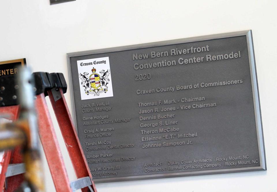 A plaque in New Bern Riverfront Convention Center lists the names of the County Commissioners.