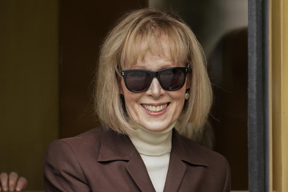 E. Jean Carroll, smiling, walks out of federal court.