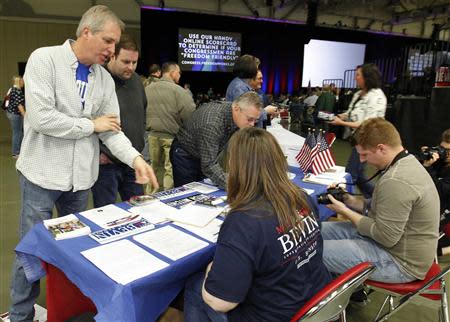 Campaign workers for U.S. Senate candidate Matt Bevin (R-KY) staff an information table at FreePAC Kentucky in Louisville, Kentucky, April 5, 2014. REUTERS/John Sommers II