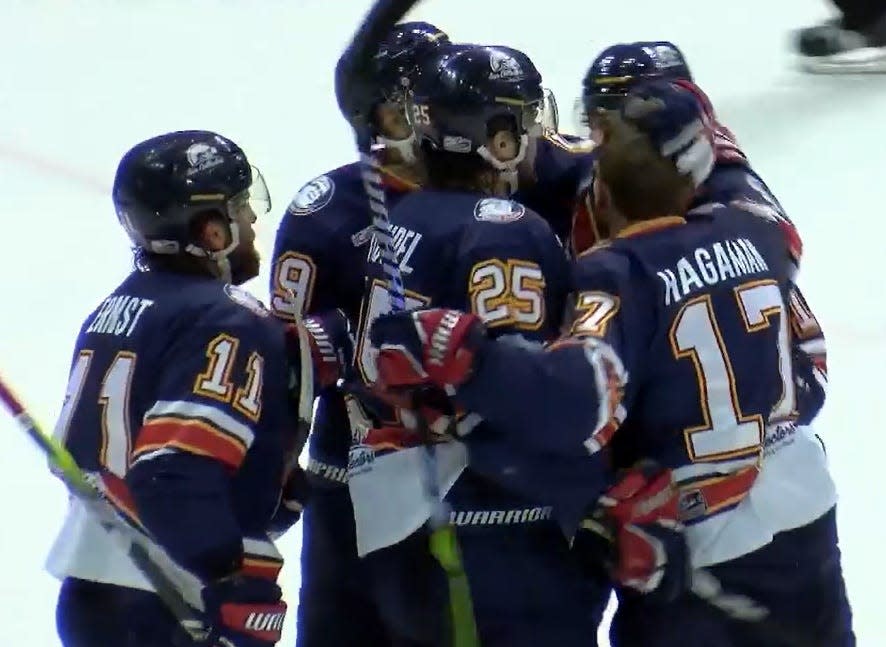 The Peoria Rivermen celebrate a goal from rookie Tristan Trudel (25) on the way to their 3-2 overtime victory against Pensacola in Game 1 of the SPHL Quarterfinals playoff series at Pensacola Bay Center on Thursday, April 11, 2024.