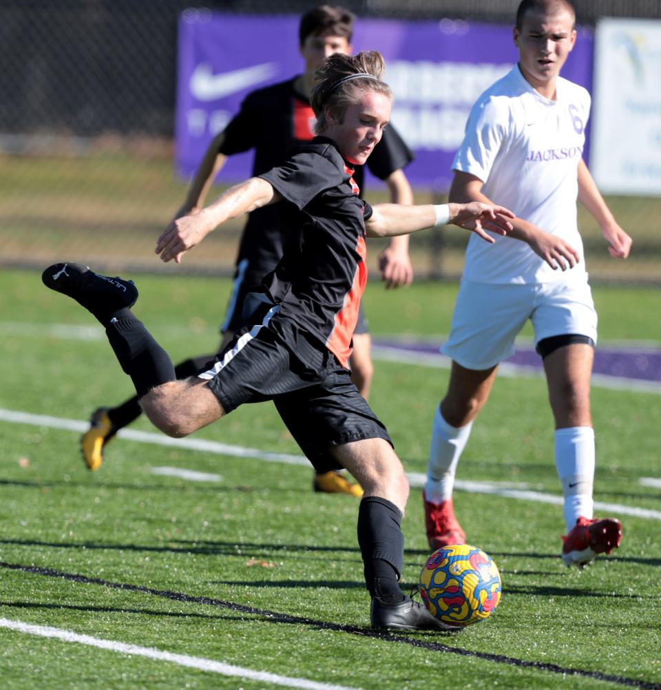Hoover's Cam VanNatta scores his team's first goal in a 2-1 win over Jackson in a Division I district final at Barberton High School, Saturday, Oct. 29, 2022.