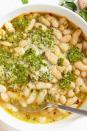 <p>White beans are a great blank canvas, especially for bright, assertive flavours like lemon and fresh herbs. Perfect as a side, or as a meal topped with a poached egg, these beans prove from-scratch really does make a difference.</p><p>Get the <a href="https://www.delish.com/uk/cooking/recipes/a33542298/cannellini-beans-recipe/" rel="nofollow noopener" target="_blank" data-ylk="slk:Cannellini Beans with Herb Sauce;elm:context_link;itc:0;sec:content-canvas" class="link ">Cannellini Beans with Herb Sauce</a> recipe.</p>