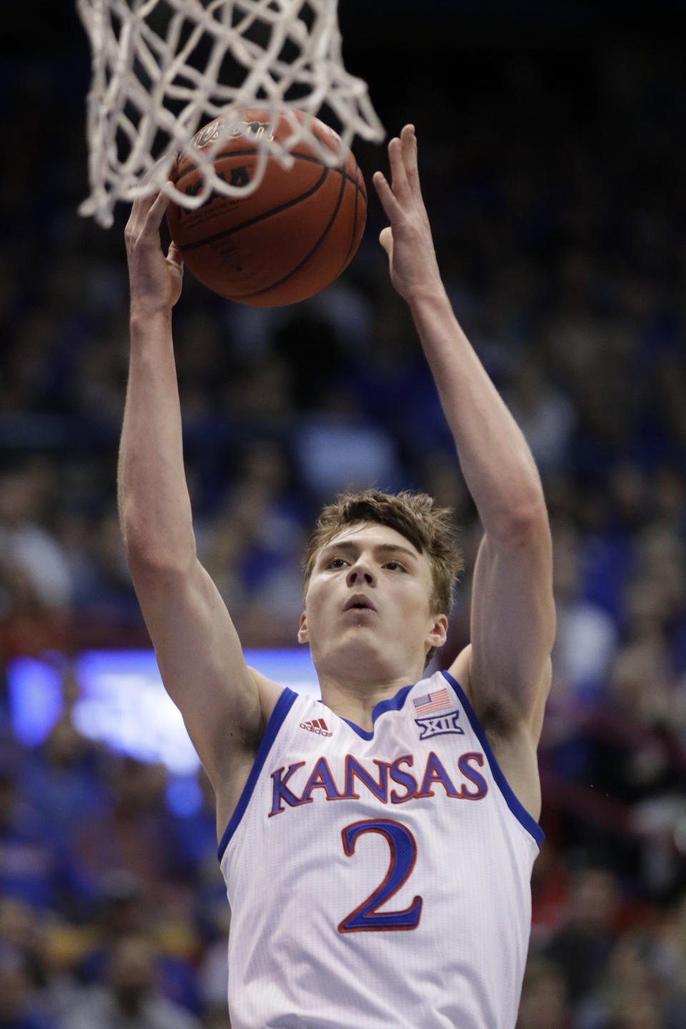 Kansas guard Christian Braun (2) makes a basket after a steal during the first half of an NCAA college basketball game against Iowa State in Lawrence, Kan., Monday, Feb. 17, 2020. (AP Photo/Orlin Wagner)