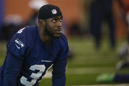 Seattle Seahawks strong safety Kam Chancellor stretches at their NFL Super Bowl XLVIII football practice in East Rutherford, New Jersey, January 30, 2014. REUTERS/Shannon Stapleton