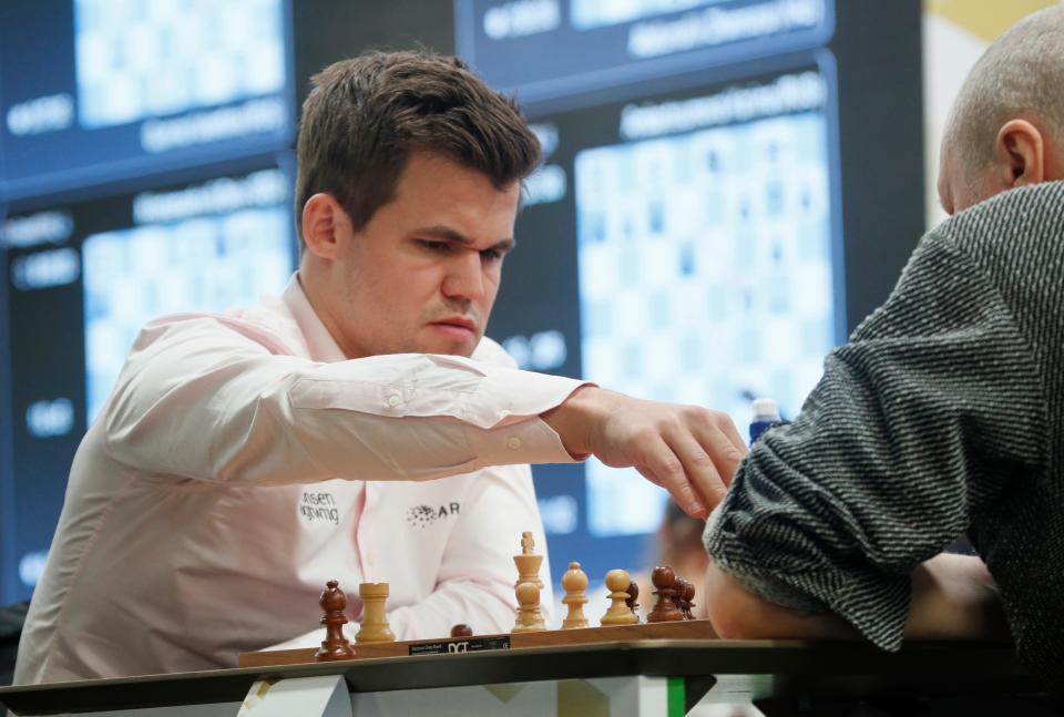 Chess World Champion Magnus Carlsen, left, from Norway during a game against Russia's Nikolai Vlassov during the World Rapid and Blitz Chess Championships in St. Petersburg, Russia on Dec. 26, 2018.