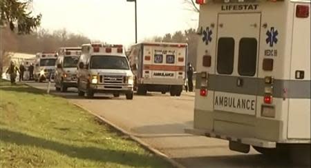 Emergency vehicles are seen outside of Franklin Regional High School after reports of stabbing injuries in Murrysville, Pennsylvania April 9, 2014, in this still taken from video courtesy of WPXI. REUTERS/WPXI/Handout via Reuters