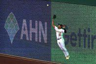 Pittsburgh Pirates right fielder Cal Mitchell leaps to make the catch on a fly ball hit by Colorado Rockies' Charlie Blackmon during the third inning of a baseball game in Pittsburgh, Tuesday, May 24, 2022. (AP Photo/Gene J. Puskar)