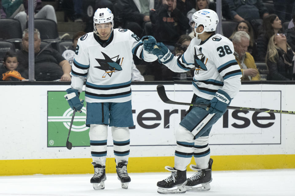 San Jose Sharks right wing Kevin Labanc (62) celebrates his goal against the Anaheim Ducks with defenseman Mario Ferraro (38) during the second period of an NHL hockey game in Anaheim, Calif., Friday, Jan. 6, 2023. (AP Photo/Kyusung Gong)