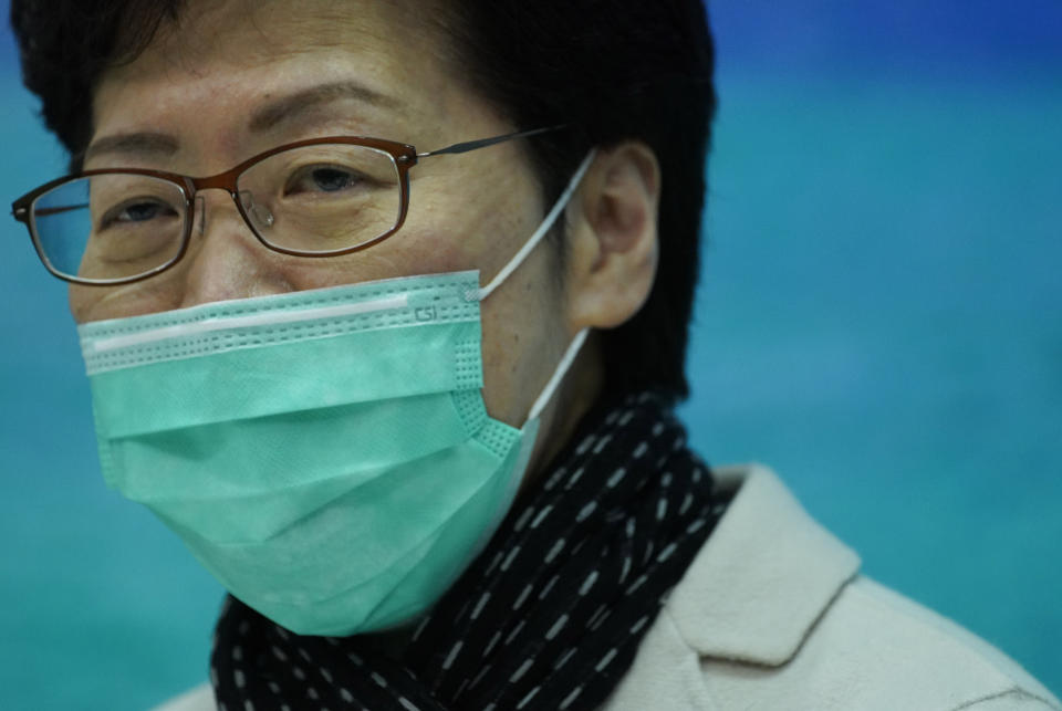 Hong Kong Chief Executive Carrie Lam wears a protective face mask speaks during a press conference held in Hong Kong, Tuesday, Jan. 28, 2020. Hong Kong's leader has announced that all rail links to mainland China will be cut starting Friday as fears grow about the spread of a new virus. (AP Photo/Vincent Yu)