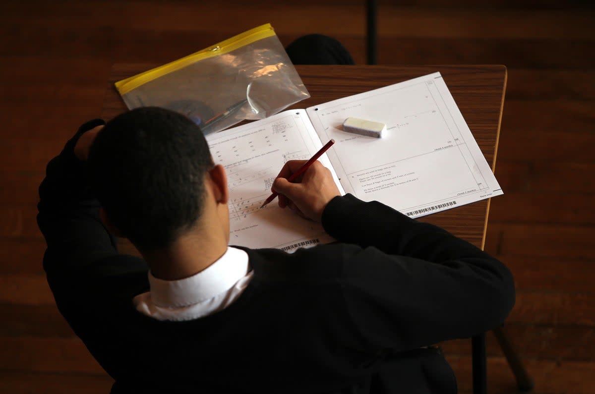 A student doing an exam (David Davies/PA) (PA Archive)