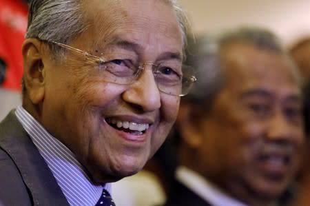 Malaysia's Prime Minister Mahathir Mohamad reacts during a news conference in Putrajaya