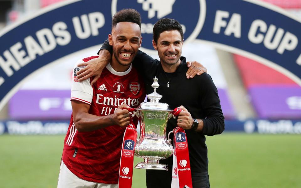 Arsenal manager Mikel Arteta and Pierre-Emerick Aubameyang celebrate with the trophy after winning the FA Cup - Mikel Arteta feared Pierre-Emerick Aubameyang would not commit his future to Arsenal - REUTERS