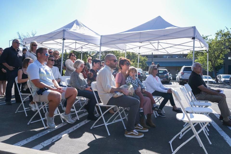 People listen during the memorial for Jessica Besser and Matthew Chachere in San Luis Obispo on Oct. 21, 2023. The memorial was held at the 3400 block of Sacramento Drive, where Besser and Chachere were killed by a vehicle in Nov. 2022.